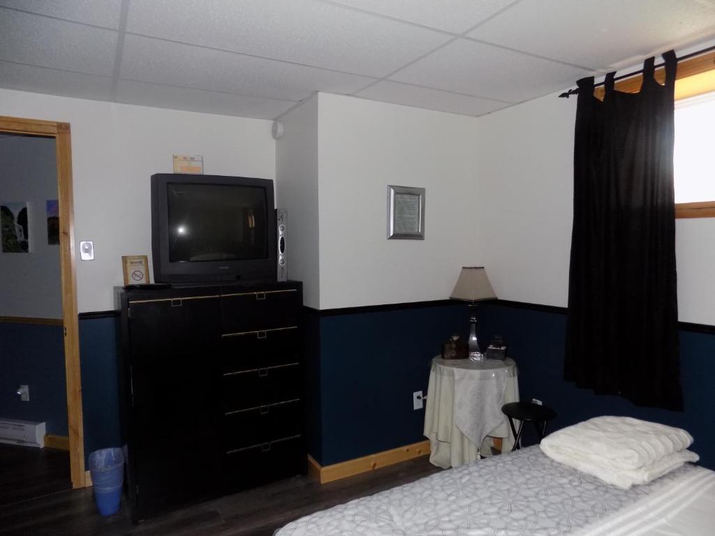 Una cama o camas en una habitación de Gîte Esprit Follet