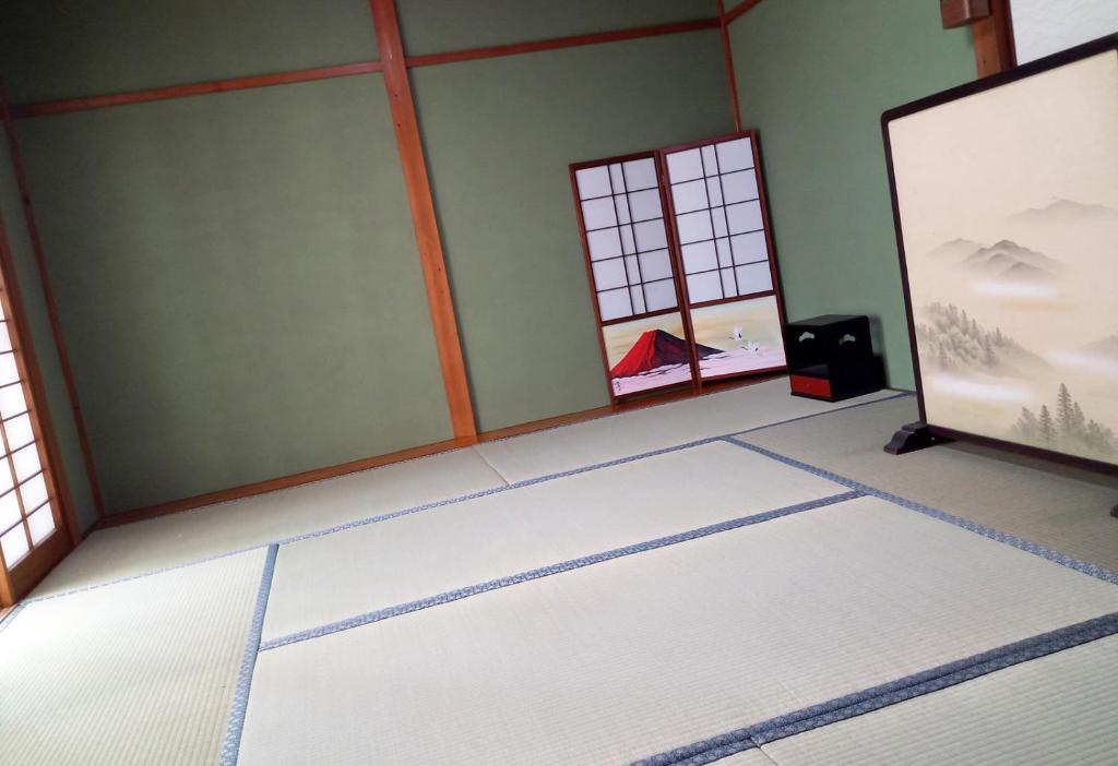 TV a/nebo společenská místnost v ubytování Kyoto Villa Kotone