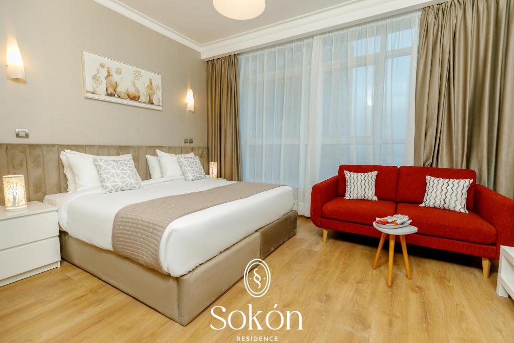 Postel nebo postele na pokoji v ubytování Sokon Residence Nile view at Maadi