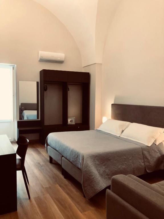 Postel nebo postele na pokoji v ubytování B&B dai Mimmi