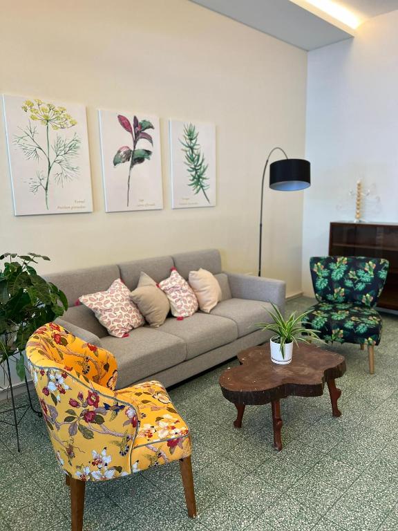 a living room with a couch and a chair at myROOM @ Mandalay Georgetown, Off Jln Burma, Gurney Drive in George Town