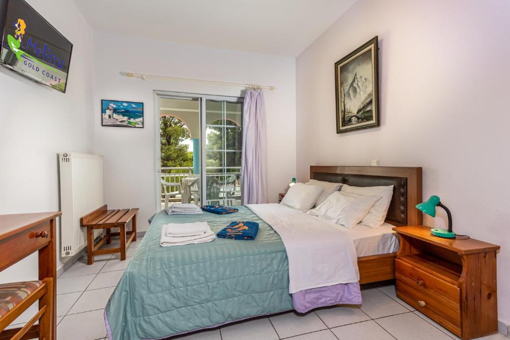 Postel nebo postele na pokoji v ubytování Melissa Gold Coast