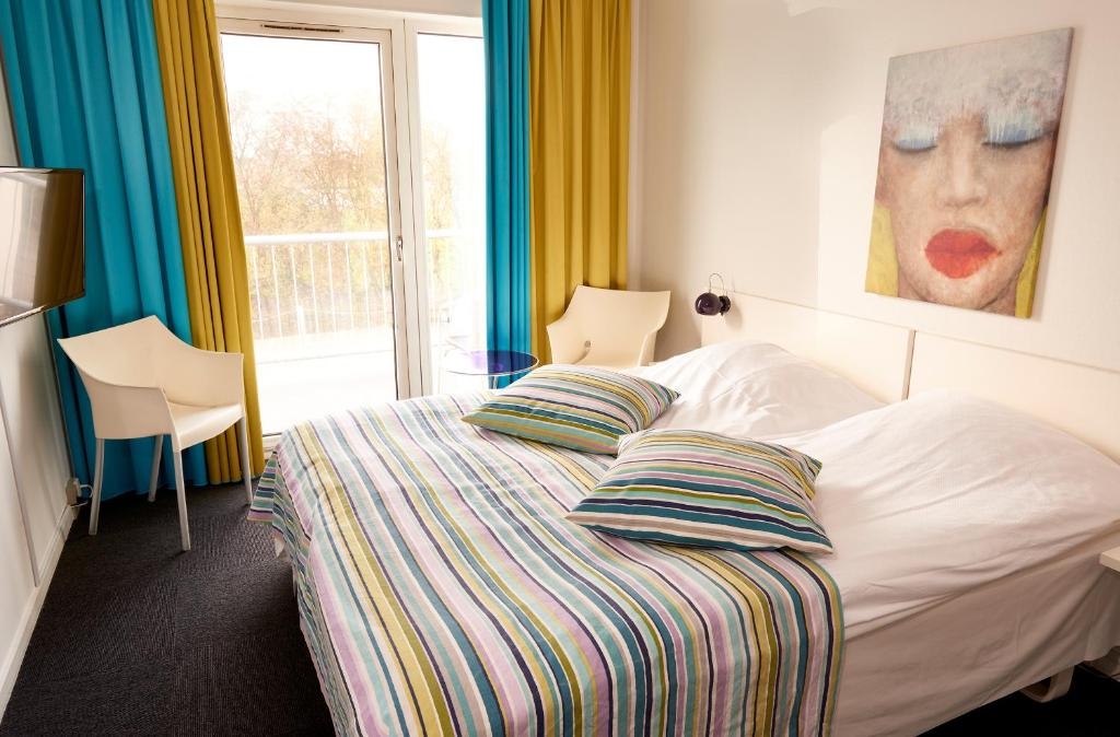 Postel nebo postele na pokoji v ubytování Hotel Faaborg Fjord