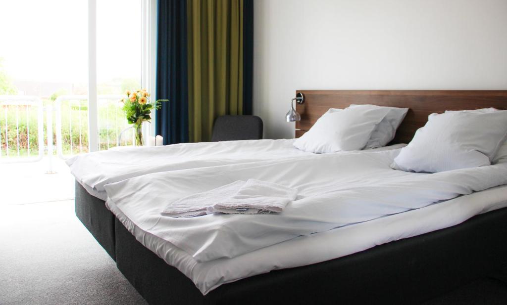 Postel nebo postele na pokoji v ubytování Hotel Faaborg Fjord
