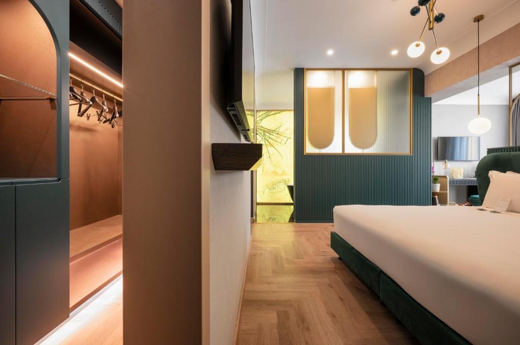 Postel nebo postele na pokoji v ubytování Je Rome Hotel