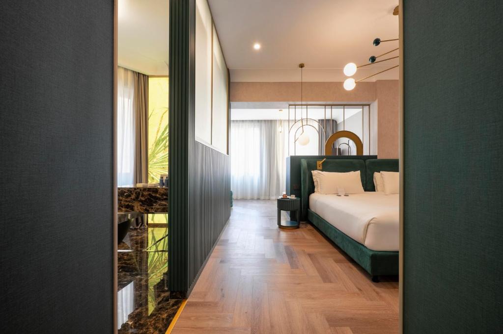 Postel nebo postele na pokoji v ubytování Je Rome Hotel