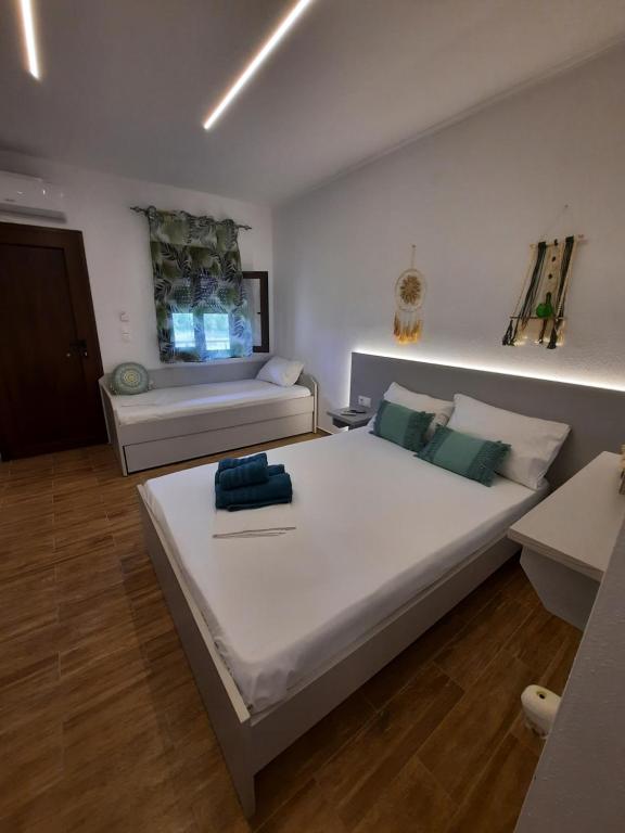 Postel nebo postele na pokoji v ubytování Bungalows anestis