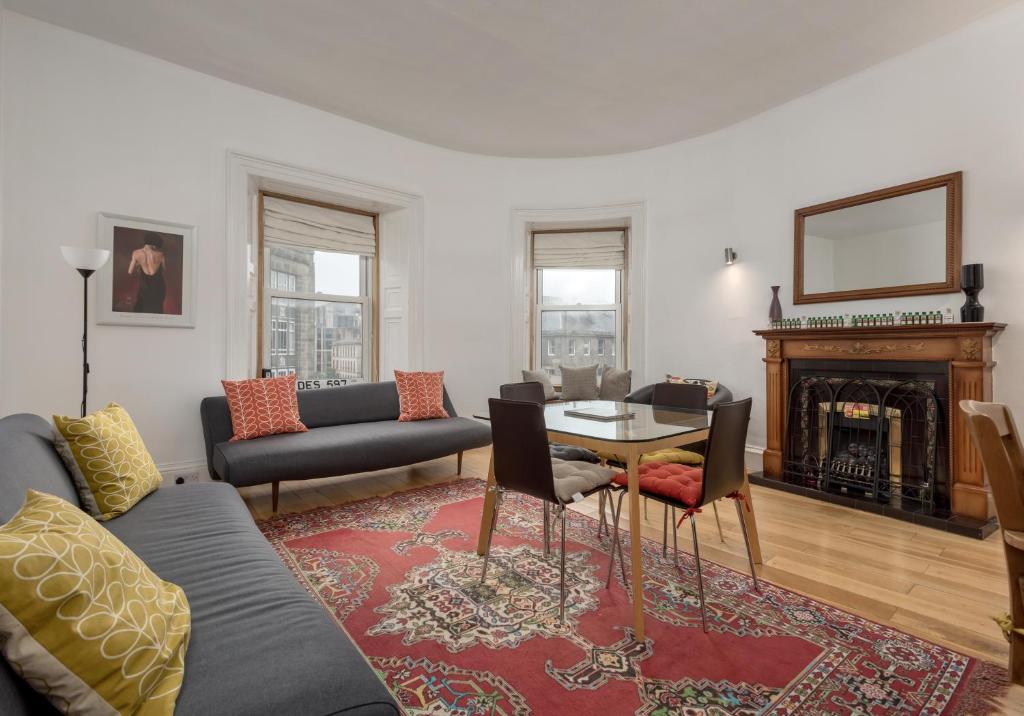 a living room with a couch and a table at The Lothian Road Residence in Edinburgh