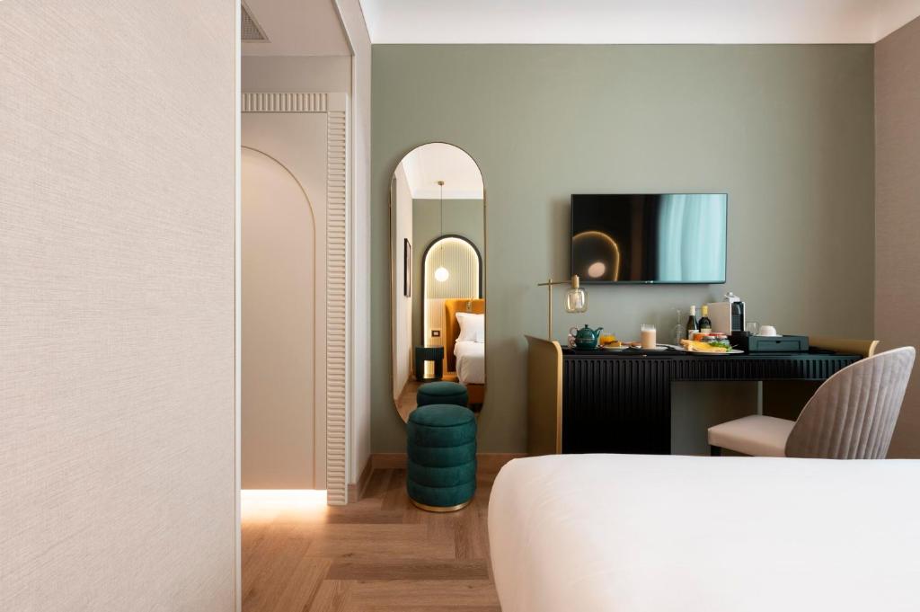 Postel nebo postele na pokoji v ubytování Je Rome Hotel
