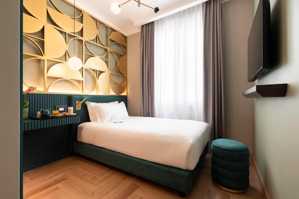 Postel nebo postele na pokoji v ubytování Je Rome Hotel
