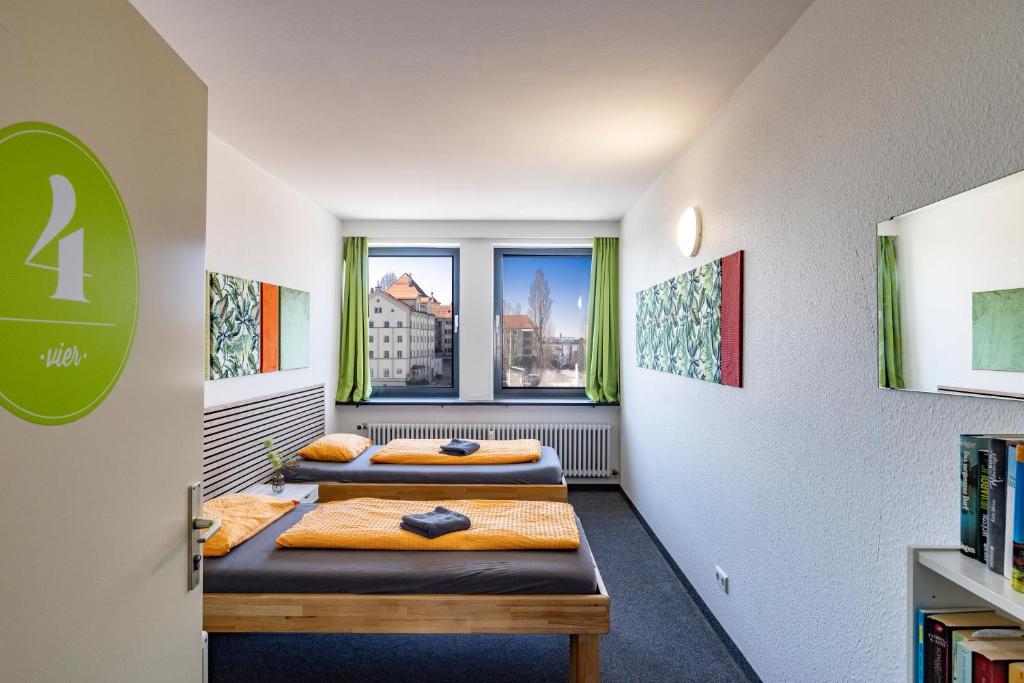 Postel nebo postele na pokoji v ubytování Inselhostel