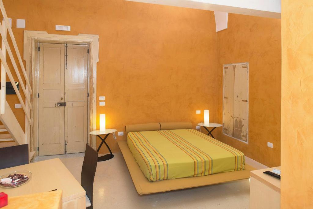 Posteľ alebo postele v izbe v ubytovaní Relais Carlo V - Palazzo Storico