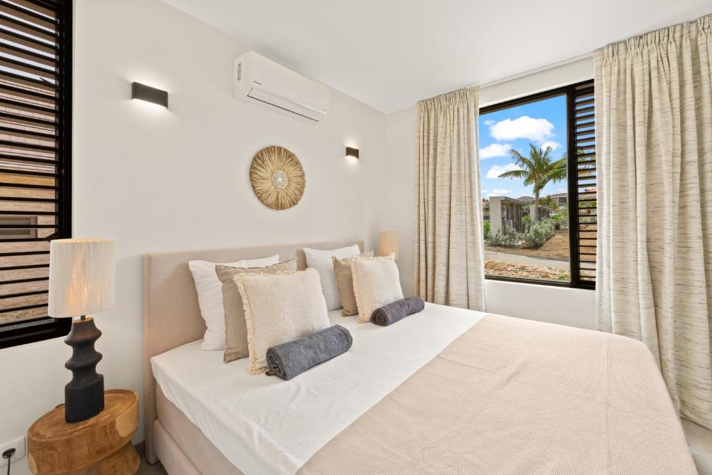 Postel nebo postele na pokoji v ubytování Blue Bay Curaçao Golf & Beach Resort