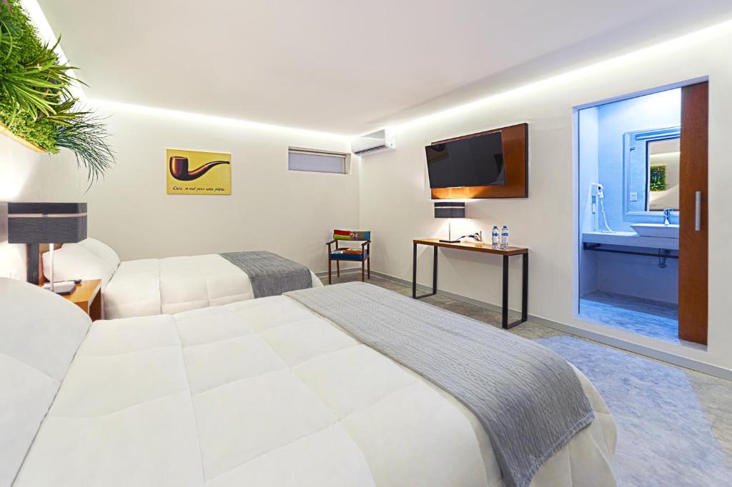 Postel nebo postele na pokoji v ubytování Hotel Urban 101