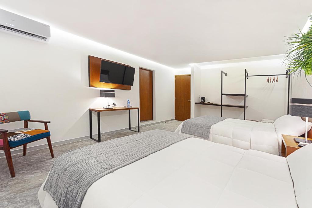 Postel nebo postele na pokoji v ubytování Hotel Urban 101