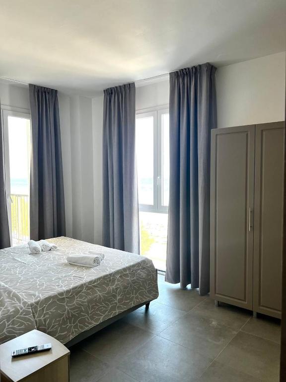 Postel nebo postele na pokoji v ubytování Hotel Marechiaro - Direttamente sul mare