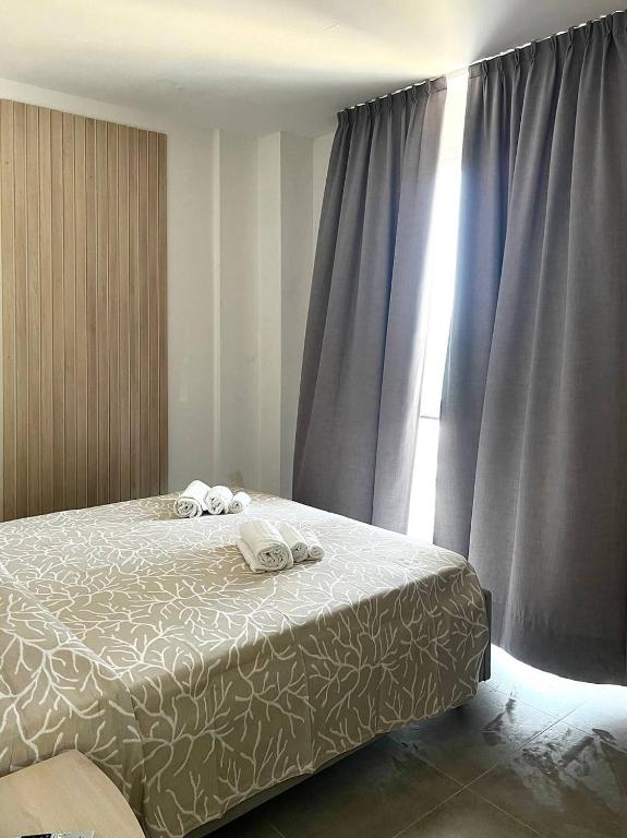 Postel nebo postele na pokoji v ubytování Hotel Marechiaro - Direttamente sul mare