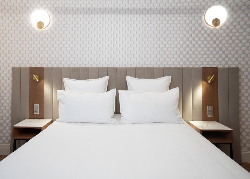 Postel nebo postele na pokoji v ubytování Hôtel Margaux