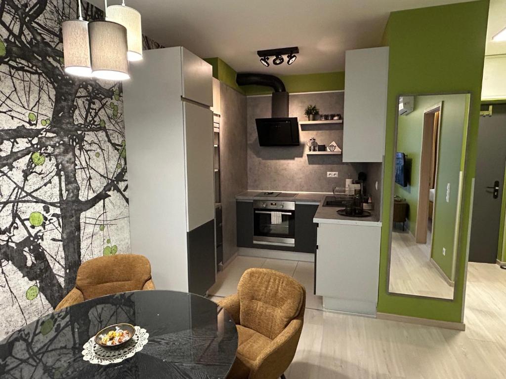 A kitchen or kitchenette at Grand Suites Corvin