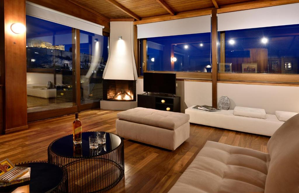 Posedenie v ubytovaní KARYATIS LUXURY MAISONETTE by K&K