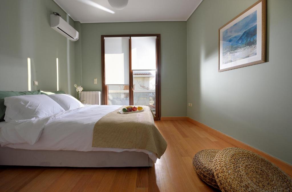 Posteľ alebo postele v izbe v ubytovaní KARYATIS LUXURY MAISONETTE by K&K