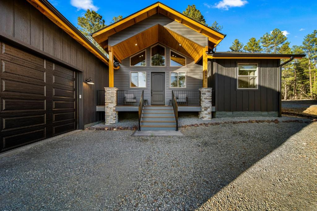a house with a garage and a driveway at Lake-View Gem w/ Outdoor Entertainment in Show Low in Show Low