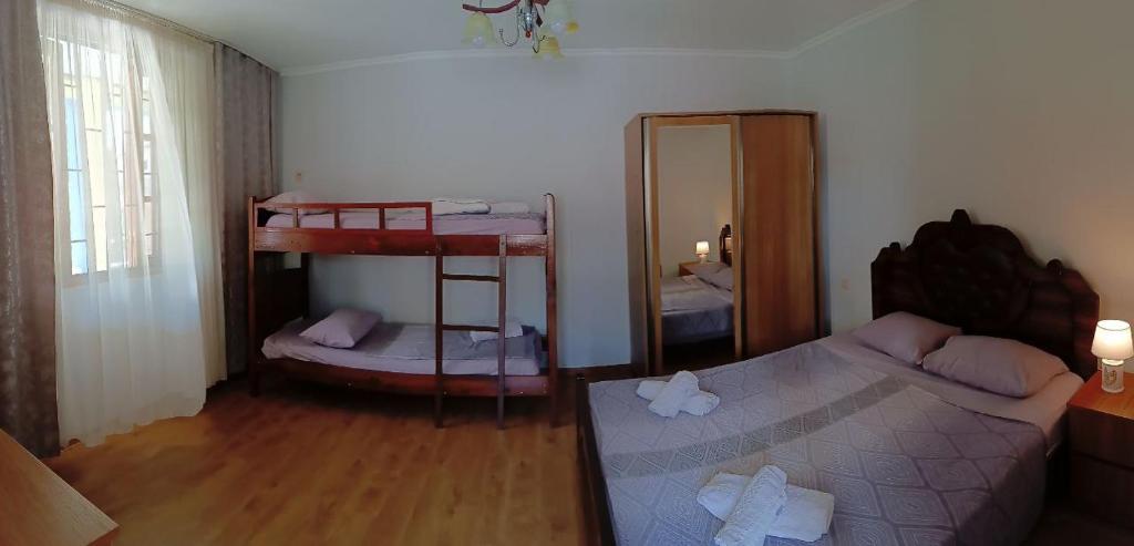 Postel nebo postele na pokoji v ubytování Guest house on Devyatnadtsataya
