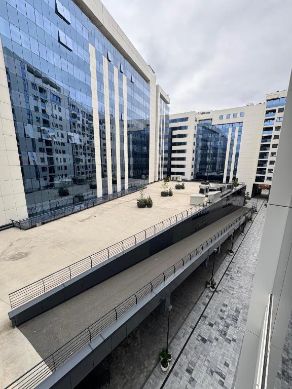 a view of a building with tall buildings at Divna-Besplatan parking in Banja Luka
