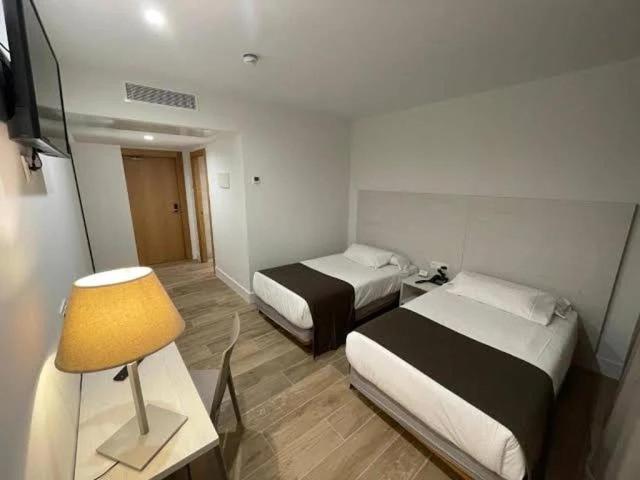 Posteľ alebo postele v izbe v ubytovaní Hotel Náutico Santander
