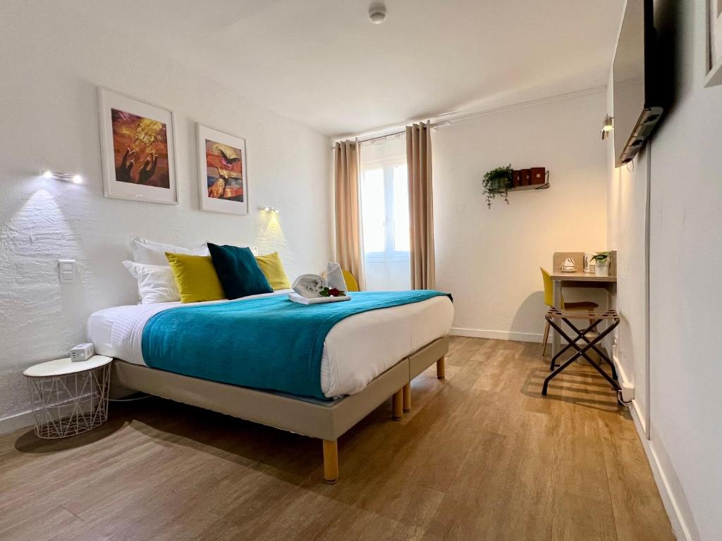 Postel nebo postele na pokoji v ubytování Hotel L'Escapade