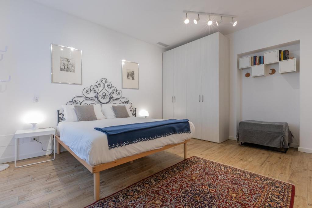 A bed or beds in a room at San Salvario Apartments by Wonderful Italy