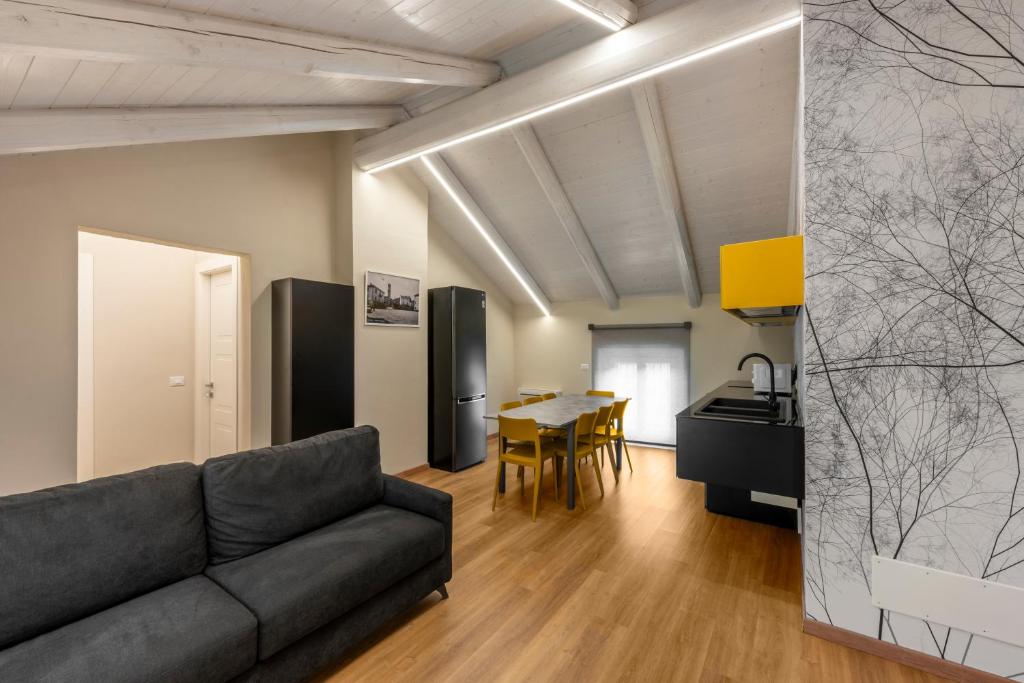 a living room with a couch and a table at La casa della Maestra Carolina in Ottiglio