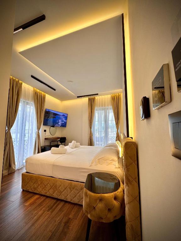 Postel nebo postele na pokoji v ubytování Martin Luxury Hotel