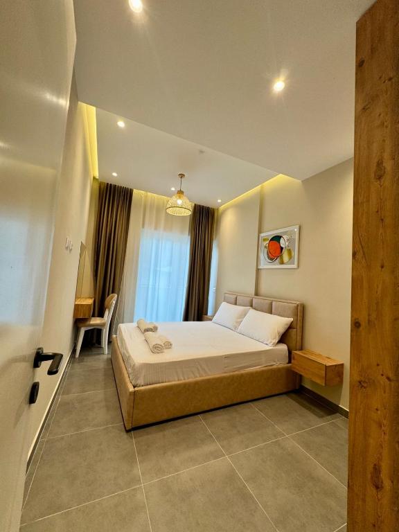 Postel nebo postele na pokoji v ubytování Apartamente Antoni Shengjin