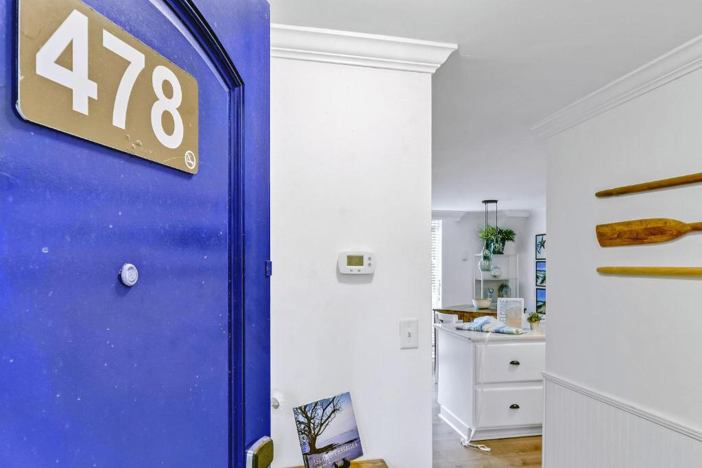 a blue door with a house number on it at Villa 478 in Jekyll Island