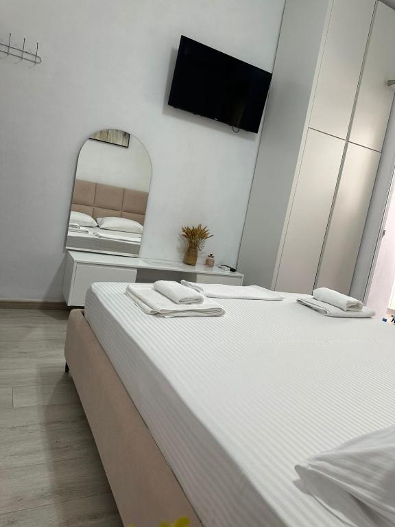 Postel nebo postele na pokoji v ubytování Dadaj Apartments