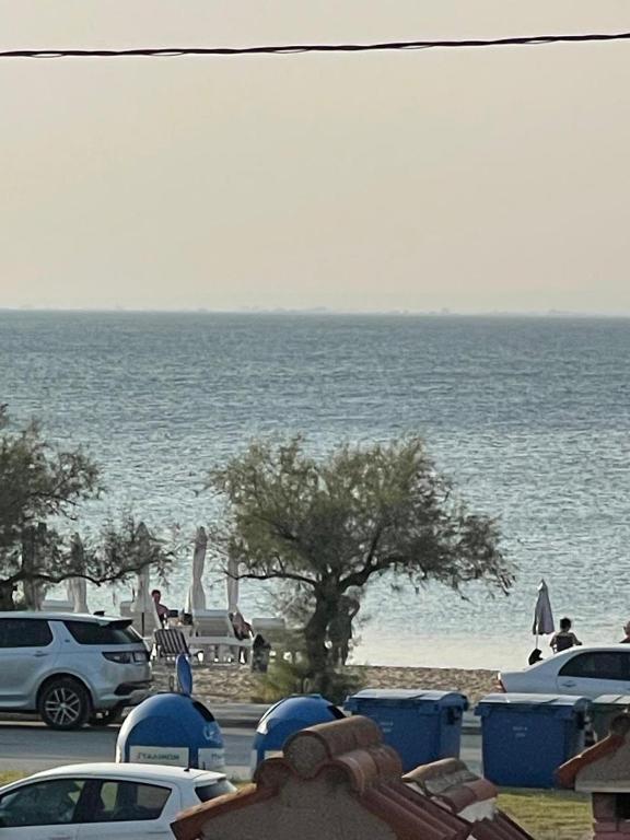 a parking lot with a view of the ocean at Aelia Seaside Maisonette in Neoi Epivates