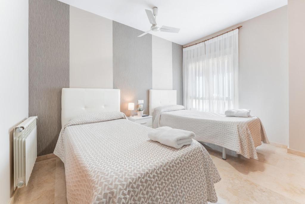 Postel nebo postele na pokoji v ubytování Hostal El Bugar