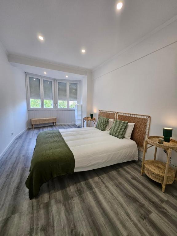 a bedroom with a large bed in a room at Estoril House in Estoril