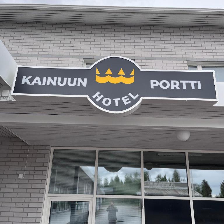 a sign on the front of a store at Hotelli Kainuunportti in Kajaani