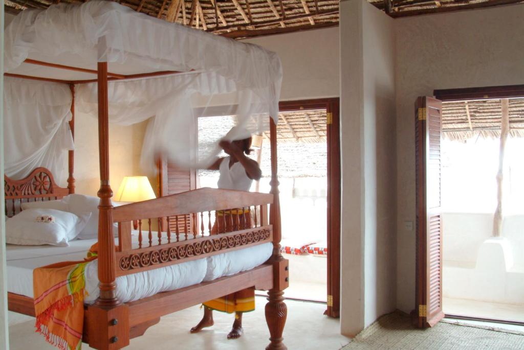 Postel nebo postele na pokoji v ubytování LAMU HOUSE