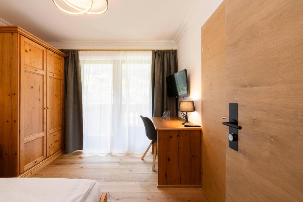 Postel nebo postele na pokoji v ubytování Hotel Stubaierhof