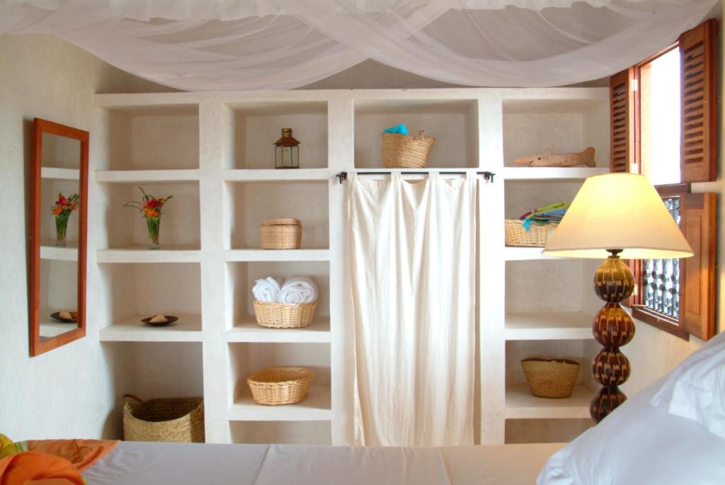 Postel nebo postele na pokoji v ubytování LAMU HOUSE