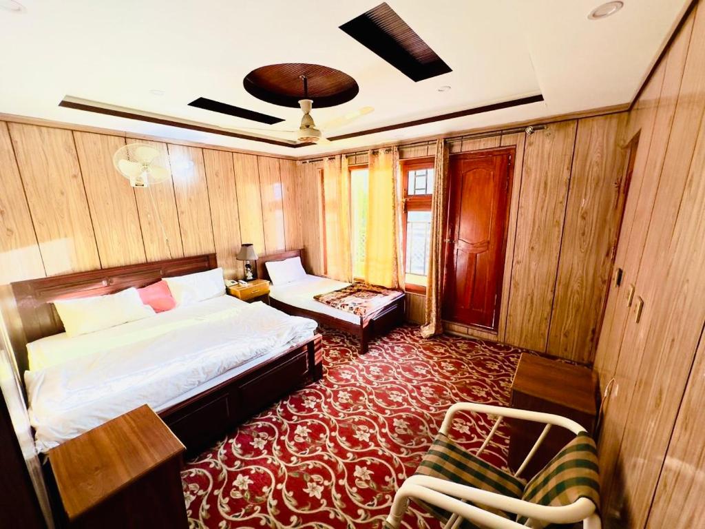 Postel nebo postele na pokoji v ubytování Skardu view point