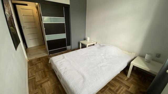 Posteľ alebo postele v izbe v ubytovaní apartament stare-polesie
