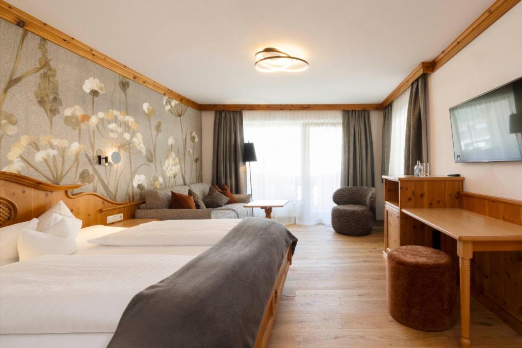 Postel nebo postele na pokoji v ubytování Hotel Stubaierhof
