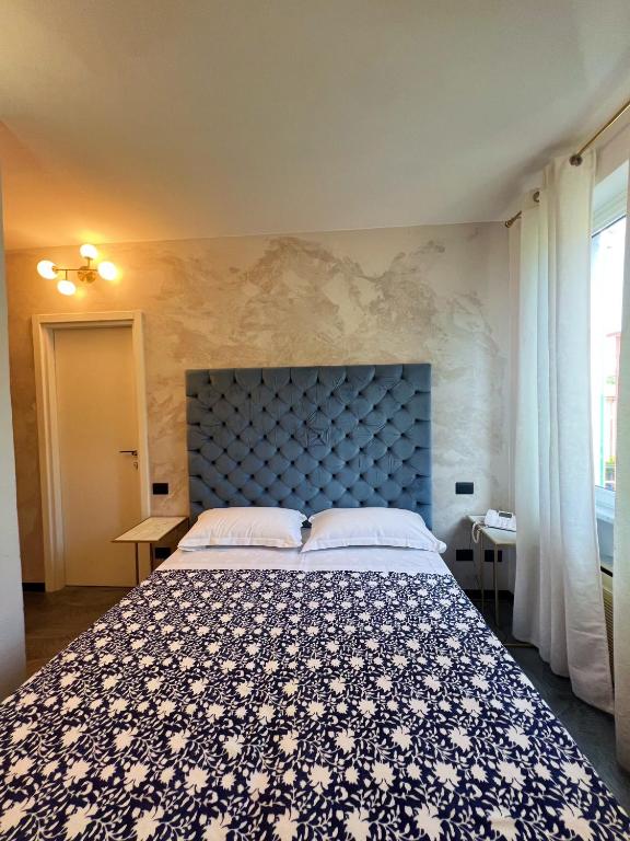 Letto o letti in una camera di Hotel Le Grazie