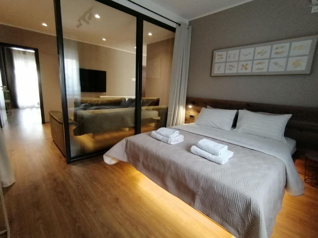 Postel nebo postele na pokoji v ubytování Apartments Knežević