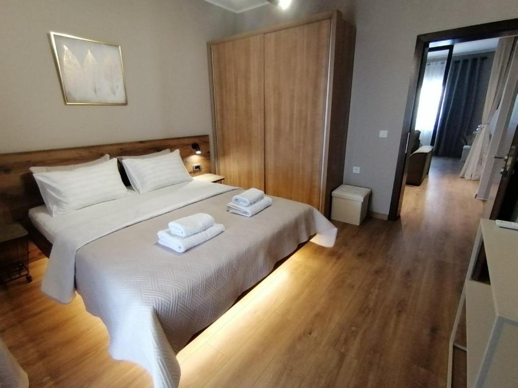 Postel nebo postele na pokoji v ubytování Apartments Knežević