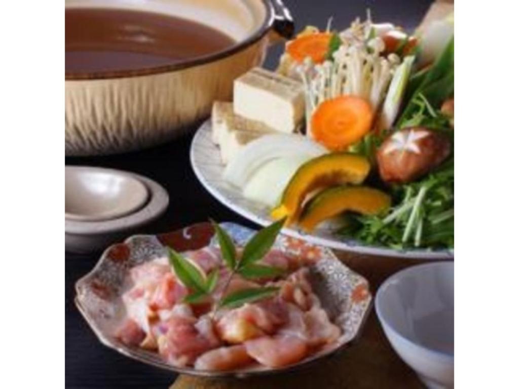 a table with two plates of food and a bowl of soup at Yumoto Onsen OharaSansou - Vacation STAY 27617v in Kyoto
